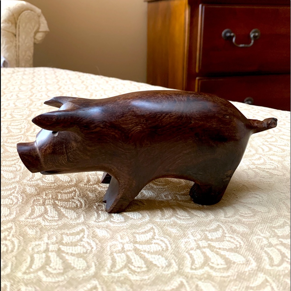 Hand carved iron wood pig.  Beautiful addition to any home.  Tip of tail broken.